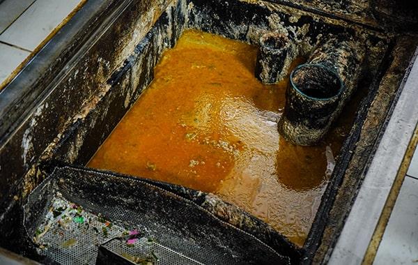 delaying grease trap cleaning can lead to foul odors, sanitation problems, and pricey repairs